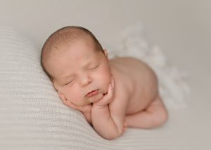 There is nothing quite like the first days of your baby’s life. The tiny fingers, the delicate eyelashes, the way they curl naturally into your chest — these fleeting details change faster than most parents expect. That’s why booking a newborn photography session within the first two weeks after your baby is born is so important. Here’s why timing matters. 1. Babies Are Sleepiest in the First Two Weeks Posed newborn photography relies heavily on baby being in a deep, restful sleep. During the first 5–14 days of life, babies tend to sleep longer stretches and are naturally more curled up — just like they were in the womb. This stage makes it possible to gently pose them in those sweet, tucked-in positions that parents love. After the two-week mark, babies become more alert, stretch out more often, and are less likely to settle into those deep sleeps needed for posed sessions. While older newborns are still beautiful to photograph, the classic posed newborn look is best achieved during those first two weeks. 2. Those Tiny Details Change Quickly Newborns grow and change at an incredible pace. Peeling skin fades, baby acne may appear, and those curled-up poses naturally disappear as they stretch and grow. Capturing them early preserves the pure, brand-new look that only lasts a short time. It’s not just about the poses — it’s about documenting a moment you can never get back. 3. Photographers Often Book Up Months in Advance Many professional newborn photographers limit the number of sessions they take each month. Because babies arrive around the same seasonal waves, calendars fill quickly — sometimes months ahead. If you wait until the baby is born to start looking for a photographer, you may find limited availability, especially if you’re hoping for a session within that ideal 5–14 day window. 4. Contact Photographers in Your Second or Third Trimester The best time to reach out and secure your spot is during your second or early third trimester. Most newborn photographers book based on your due date and then adjust once baby arrives. Booking ahead: Guarantees availability around your due date Gives you time to plan styling and colors Allows you to review the photographer’s portfolio and feel confident in your choice Takes one big task off your plate before baby arrives Once your little one is here, your focus should be on recovery, bonding, and soaking up those newborn snuggles — not scrambling to find last-minute availability. 5. Peace of Mind for New Parents Planning ahead provides peace of mind. You’ll know your memories are secured, and all you’ll need to do after birth is send a quick message to confirm baby’s arrival. Those first two weeks go by in a blur of feedings, diaper changes, and sleepless nights. Having your session already scheduled allows you to simply show up and enjoy the experience. The newborn stage is incredibly short, but photographs last forever. By booking your session during pregnancy and planning for those first two weeks, you ensure that the tiniest details — the sleepy smiles, curled toes, and squishy cheeks — are beautifully preserved. newborn photography packages Boston 1